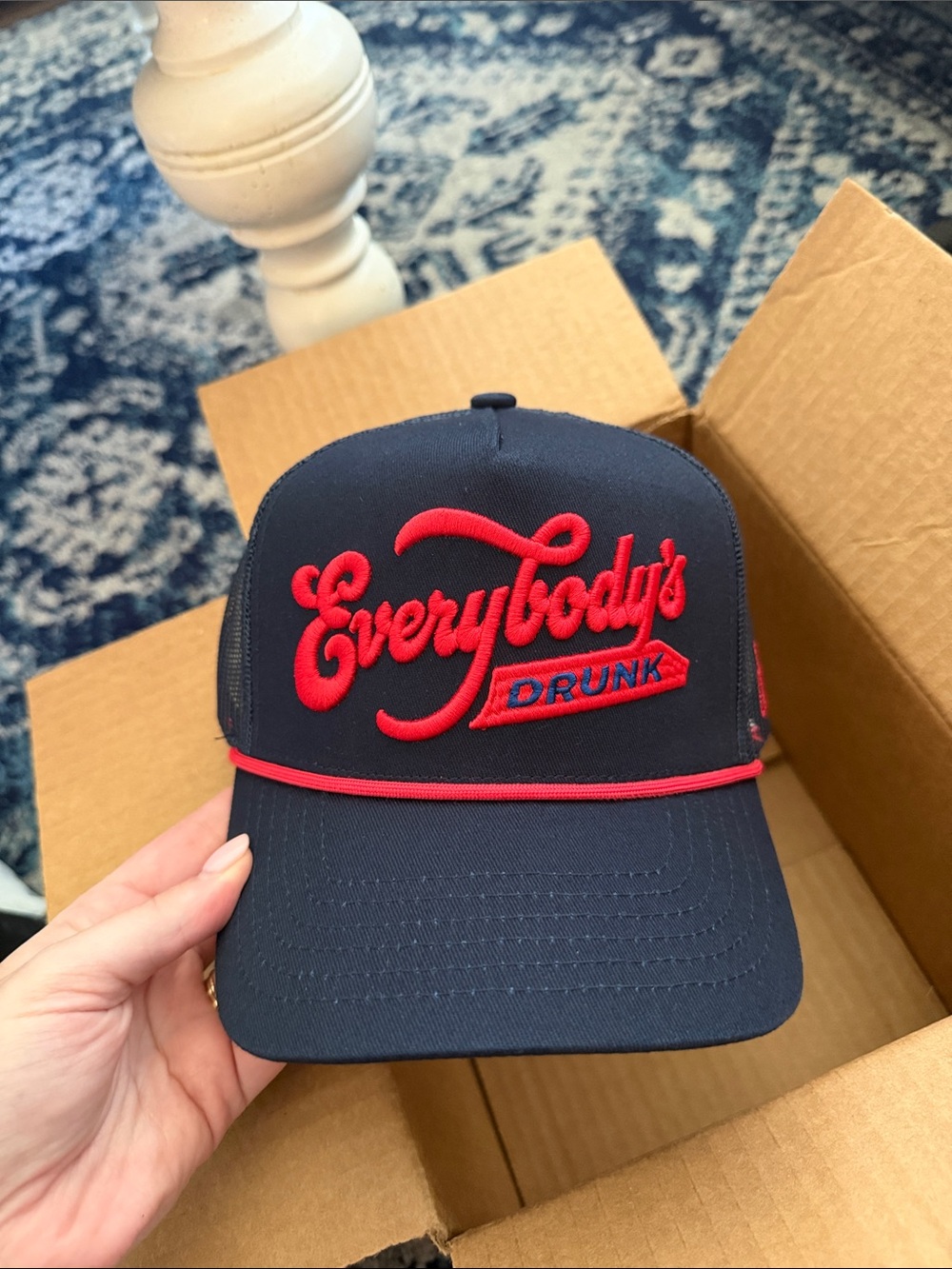 Everybody's Drunk Navy Trucker Hat with Red Embroidery